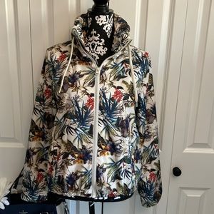 Atmosphere tropical floral print rain jacket with front zip and hidden hood